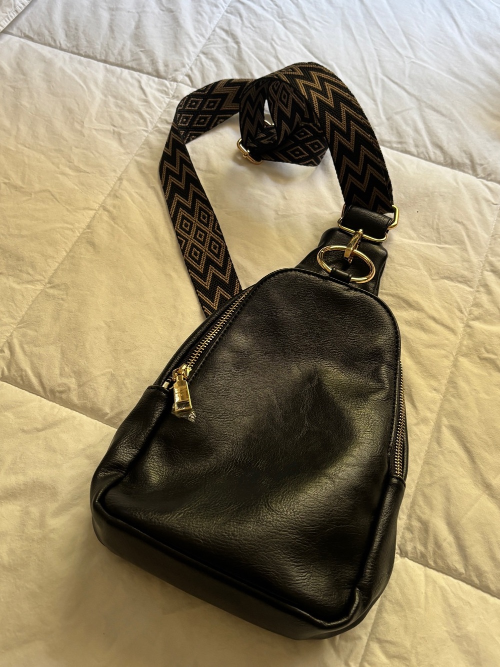 Black Leather Sling Crossbody Bag with Patterned Strap